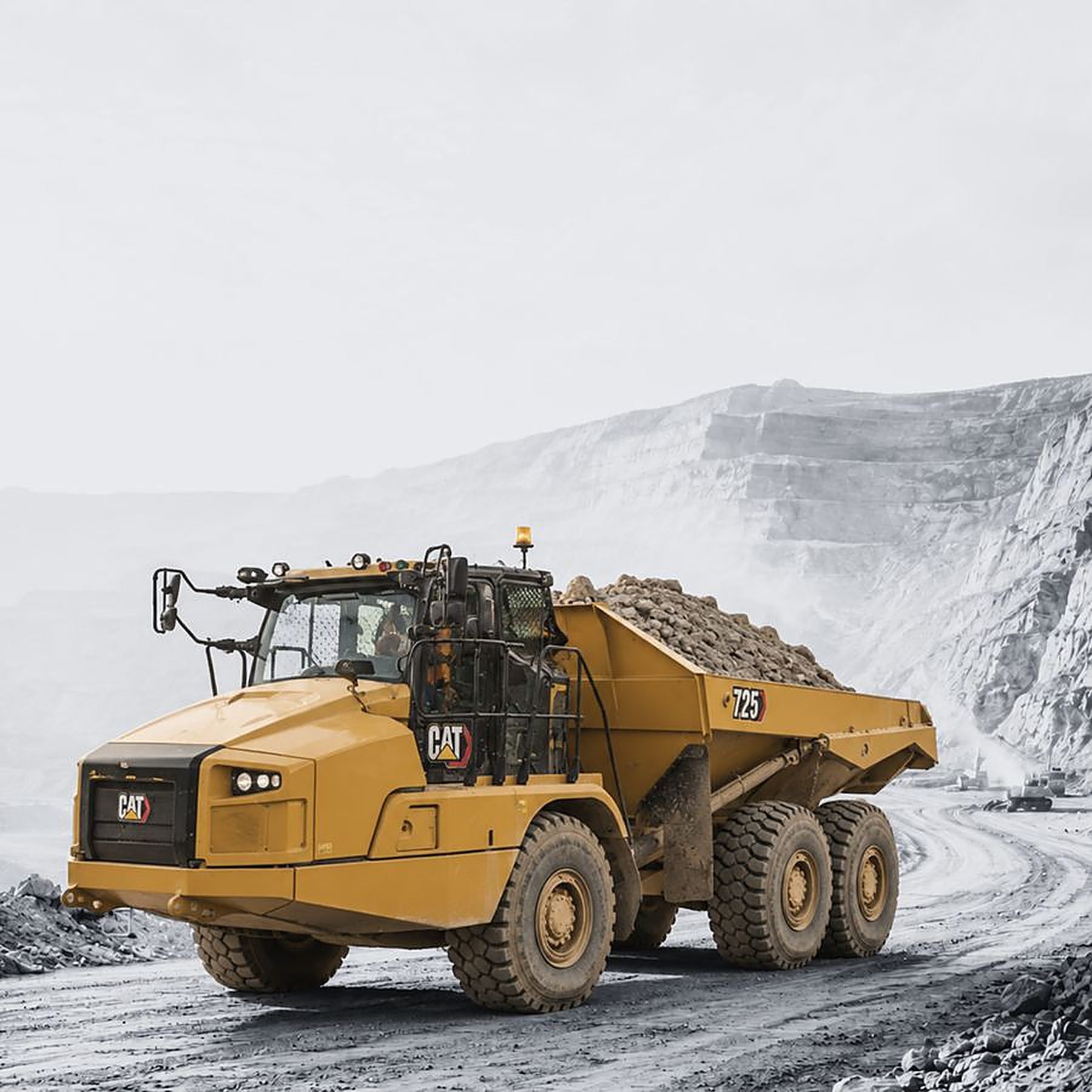 Articulated haul truck on an open-cut mine haul road